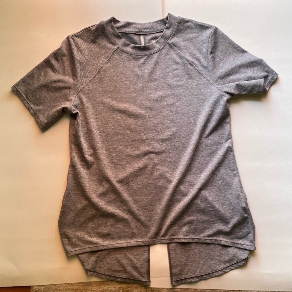 Gray heather tennis top. SM. Nice detail on the back. Like new. Short sleeves.